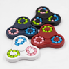 A set of four Spin Buddy Puzzle Games in red, white, black, and navy, featuring colourful beads in pink, green, and blue.