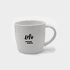 A white ceramic mug with a handle and a logo printed on the side.