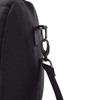 A black duffel bag featuring a sturdy strap attachment point with a metal clip.