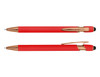 A red stylus pen with rose gold accents, featuring both a click mechanism and a soft touch tip.