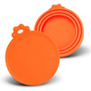 A set of silicone reusable can lids in vibrant orange, featuring a circular design with a handle on top.