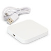 A square white wireless charger with a USB cable. The charger has a sleek design and a simple appearance.