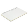 A medium-sized notebook with a spiral binding and blank cream pages. It has a plain cover.