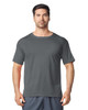 A man wearing a grey Gildan Performance adult t-shirt, featuring a casual fit and short sleeves.
