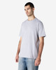 A grey Gildan Softstyle adult enzyme wash no label t-shirt on a male model, paired with blue jeans.