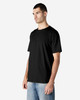 A black Gildan Softstyle adult enzyme wash t-shirt on a model, featuring short sleeves and a relaxed fit.