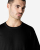 A black Gildan Softstyle adult enzyme wash no-label T-shirt displayed on a male model.