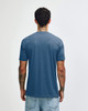 A back view of an American Apparel Tri-Blend T-shirt in blue, featuring short sleeves and a logo.