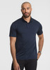 A man stands wearing a navy blue short sleeve polo shirt, featuring a collar and a logo.