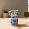 A stackable coffee mug set featuring colourful, patterned designs on white ceramic with a glossy finish.