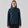 A women's softshell jacket in navy blue with a full zipper and side pockets, featuring a branded logo.