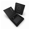 A black wireless power bank in an open box, with a USB cable and branding visible inside.
