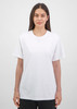 A white women's short sleeve tee is displayed on a model against a neutral background. The shirt has a relaxed fit.