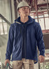 A blue unisex softshell jacket features a hood, shown being worn by a person in a construction setting.