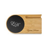 A bamboo cup warmer with a black induction charging pad, featuring branding on the surface.