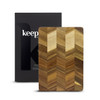 A wooden chopping board with a chevron pattern, packaged in a branded box.