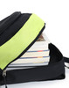 A black backpack with a bright lime green accent, partially unzipped, revealing stacked books inside.