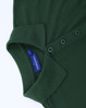 A green ladies' cotton/poly pique short-sleeve polo featuring a collar and button placket. It has a brand label.