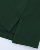 A green ladies' classic cotton/poly pique short sleeve polo, featuring detailed stitching and side slits.