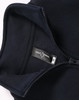 A navy 1/2 zip collar fleecy sweat with a smooth interior and a tag, featuring a logo.