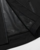 A black unisex waterproof jacket featuring a mesh lining along the inside for breathability. It has a logo.