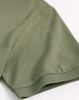 A close-up of a khaki green men's ultrafine cotton pique polo, highlighting the sleeve detail. It features a logo.