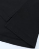 A close-up of a black polo shirt featuring short sleeves and smooth fabric texture. It includes a small logo.