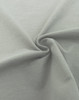 A close-up of a soft, grey fabric in a spiral formation, showcasing its smooth texture.