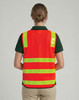 A high-visibility orange road safety vest with reflective yellow stripes, featuring a logo on the back.