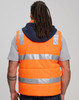 A unisex hi-vis hooded puffer vest in bright orange, featuring reflective stripes and a navy hood.