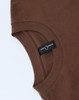 A brown unisex heavy cotton oversized tee with a round neckline and a tag visible on the inside seam.