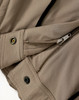A close-up of beige work pants featuring zippers and button details, designed for flexibility and durability.
