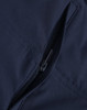 A close-up of navy water-repellent flexi work pants featuring a zippered pocket and detailed stitching.