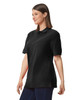 A black Gildan Hammer Adult Double Pique Polo shirt displayed on a model, featuring a subtle logo.