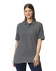 A grey Gildan Hammer Adult Double Pique Polo shirt displayed on a model, featuring a collar and a logo.