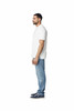 A white polo shirt displayed on a male model, paired with blue jeans and casual footwear. The shirt features a logo.