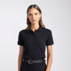 A women's polo shirt in black with a classic collar and short sleeves. It features a logo on the chest.