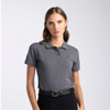 A women's polo shirt in grey, featuring a collar and short sleeves, with a logo on the chest.