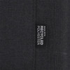 A black fabric label featuring the text "Made with Recycled Polyester." The label is sewn into the material.