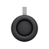 A black portable speaker with a grey strap, featuring a circular design and textured surface.