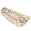 A lightweight scarf in beige and cream with a diamond pattern and ornate design along the edges.
