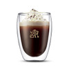 A double wall glass with a beverage topped with whipped cream and chocolate shavings, featuring a logo.