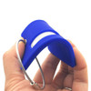 A blue silicone luggage tag held in a hand, featuring a loop for attachment and a smooth surface.