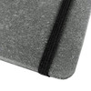 A grey notebook with a textured cover and a black elastic band closure. Features a logo on the cover.