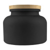 A black candle jar with a textured gold lid, featuring a round and smooth design. It has a simple, elegant appearance.