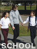 A long sleeve white button-up school shirt worn by a child, paired with dark trousers, amidst a school setting.