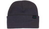 A dark grey beanie featuring a foldable cuff and a small branding label.