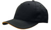 A black cap with a contrasting orange sandwich trim along the visor. It features ventilation holes and a curved brim.