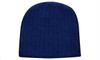 A cable knit beanie in blue with a textured pattern, featuring a logo.