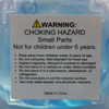 A jelly cube sensory toy in blue with a warning label about choking hazards and care instructions.